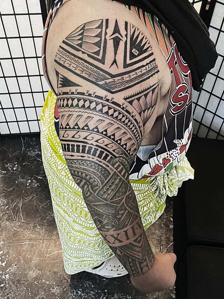 Polynesian tribal sleeve tattoo