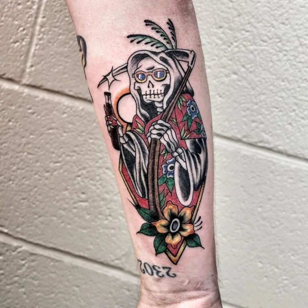American Traditional grim reaper arm tattoo